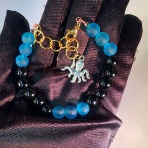 INKED OCEAN — Handcrafted Blue & Black Glass Beaded Bracelet with Octopus Charm